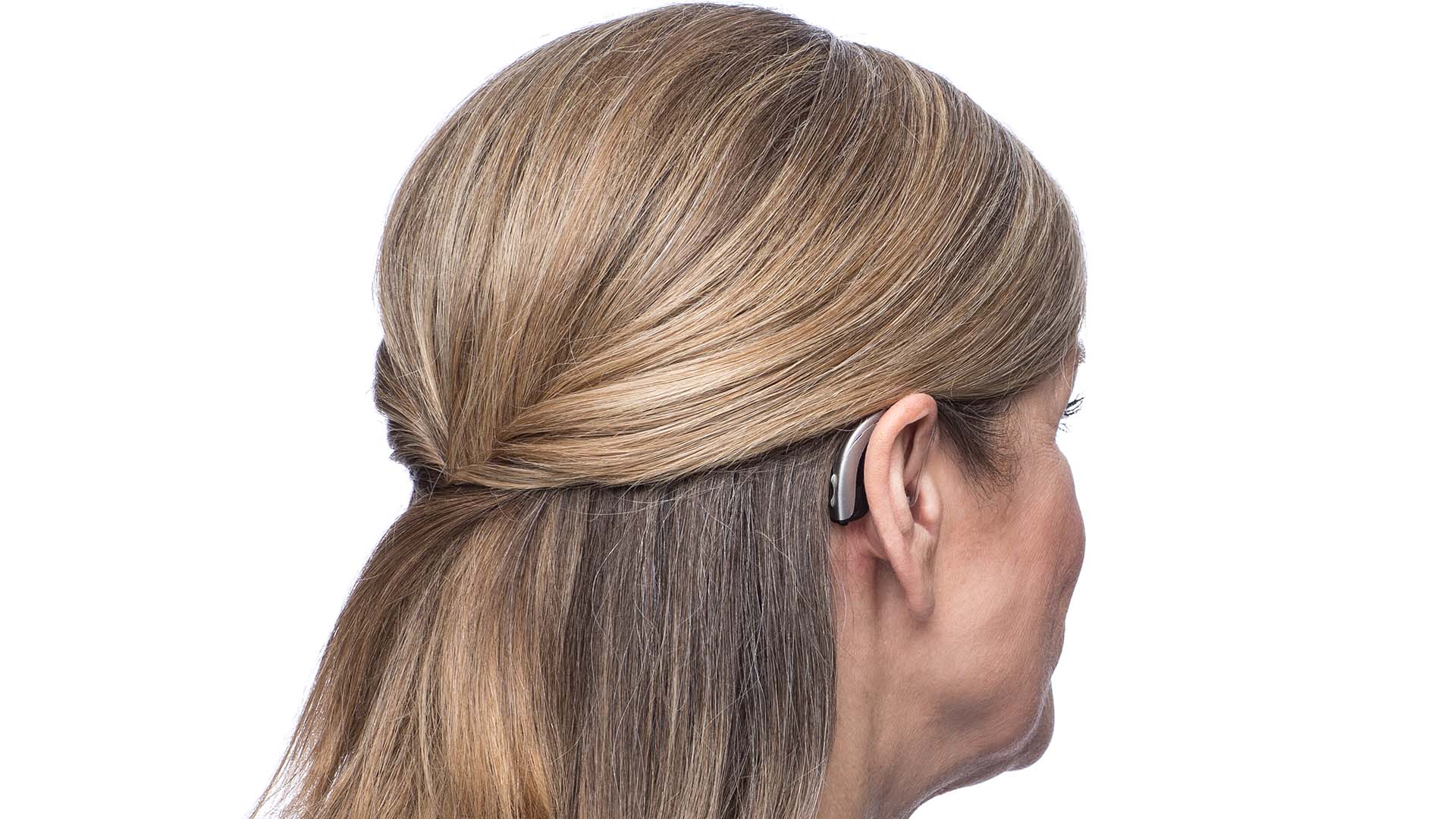 Woman with hearing aid behind-the-ear