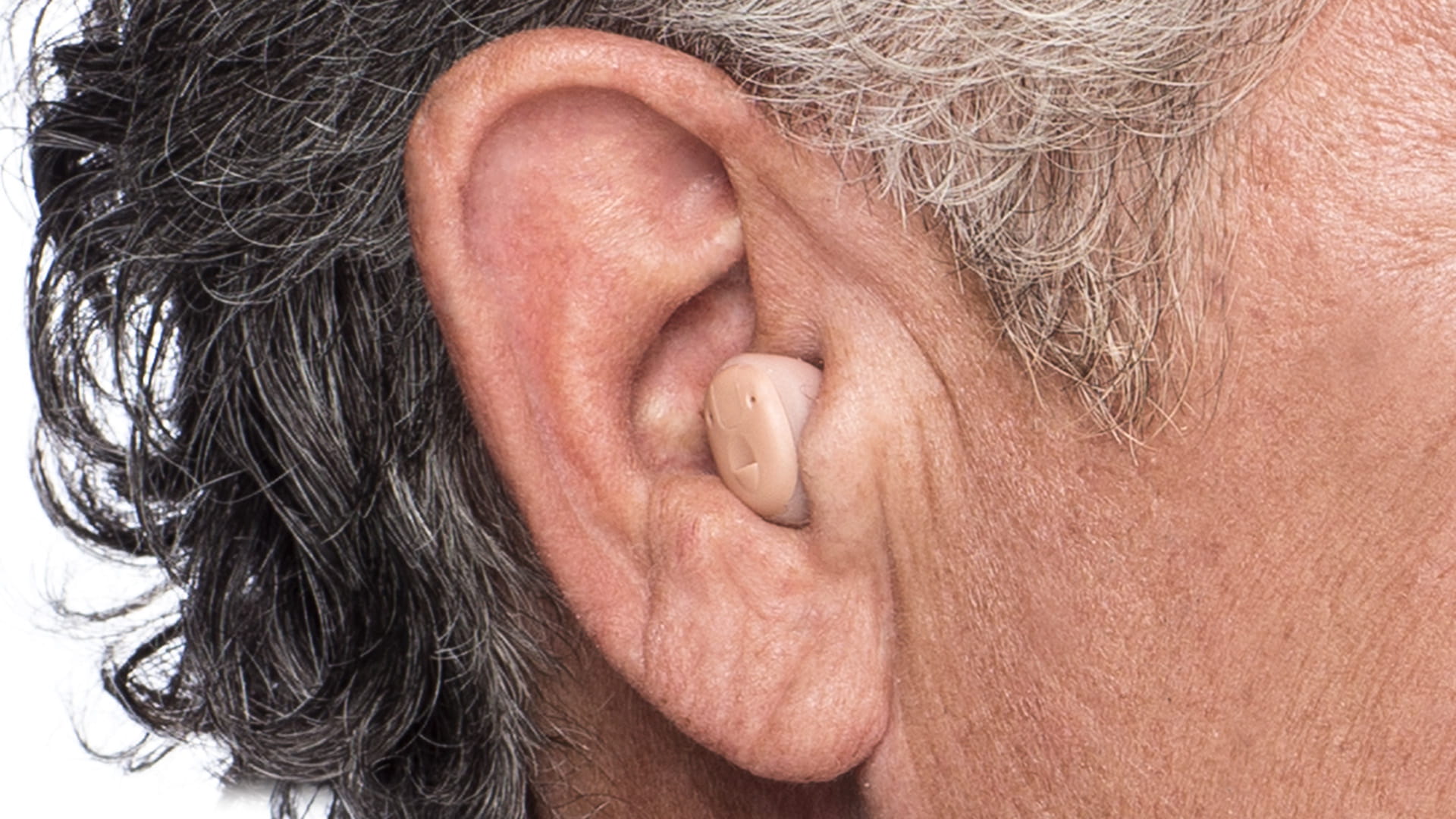 Man with hearing aid in-the-ear